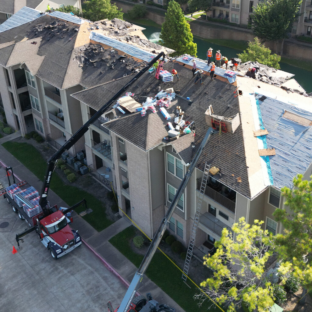 Crew on an apartment roof - aerial shot